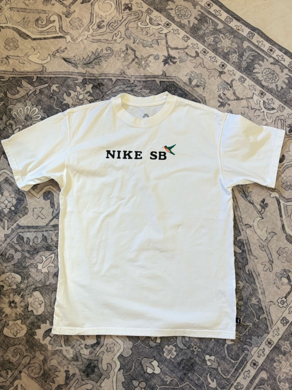 Nike SB White Short-Sleeve Tee with Small Green and Orange Swoosh